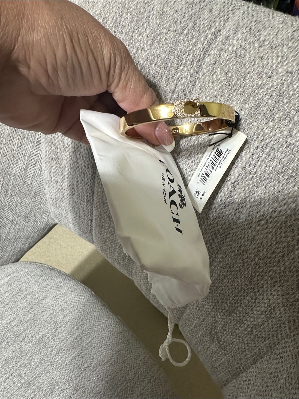 Coach Gold Tone Hinged Bangle with Crystal Accent